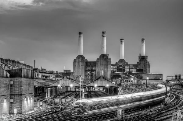 Trains pass Battersea Power Station | N.Jackson